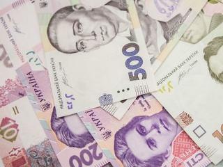 Az ukrán jegybank 25 százalékkal leértékelte a hrivnyát a dollárral szemben
