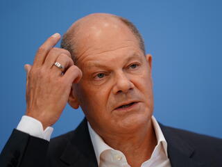 Olaf Scholz megszakította nyaralását a trükköző német költségvetés miatt